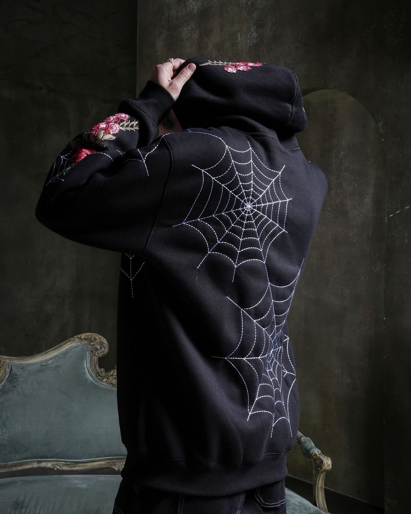 SPIDER WEBS (RED) HOODIE IN BLACK
