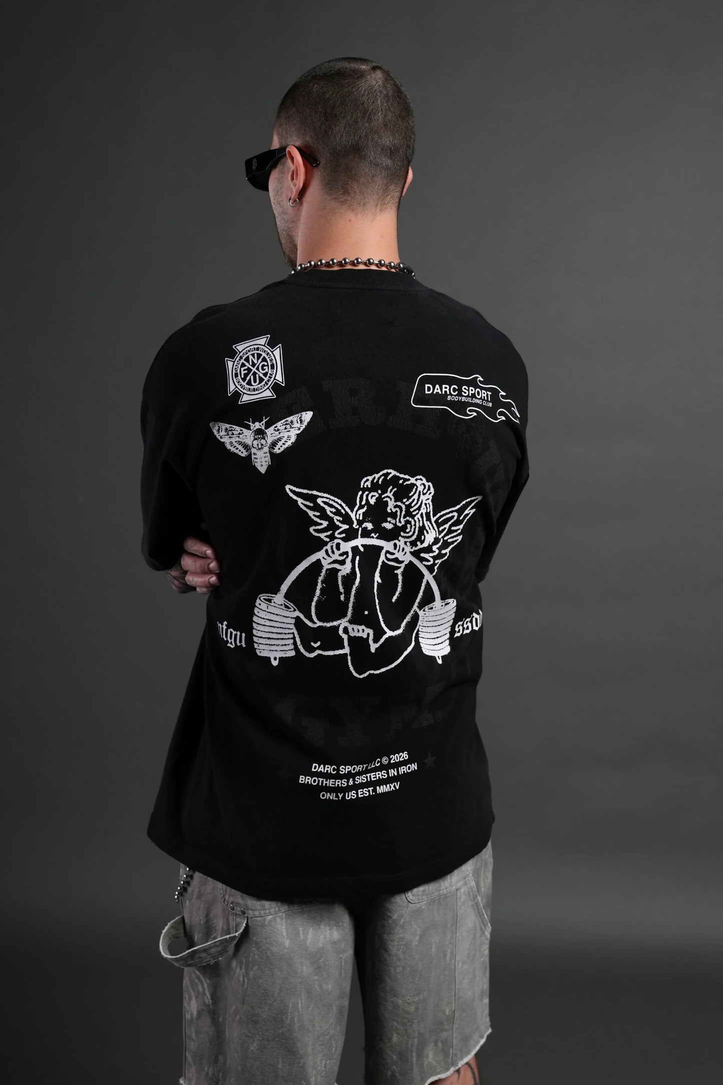 Powerhouse of the Cherub Unisex Premium Oversized Tee in Black Drift Wash